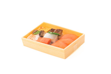 Nigiri sushi in hand with soya sauce on White Isolated background