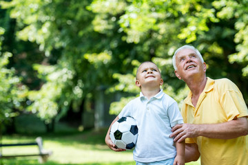 grandfather and child have fun  in park