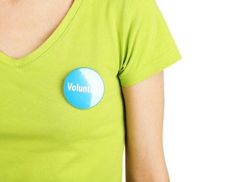 Round Volunteer Button On Shirt Of Girl Isolated On White