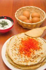 Блины с икрой на столе