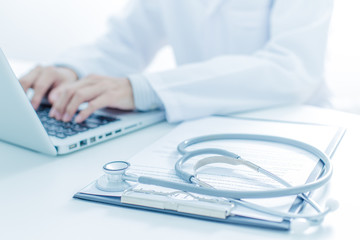 Close-up of a medical worker with laptop