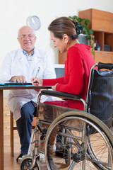 woman in   wheelchair with   doctor.