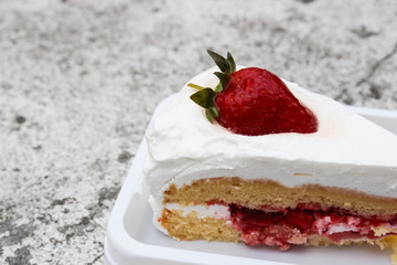 strawberry cheese cake with cream on top