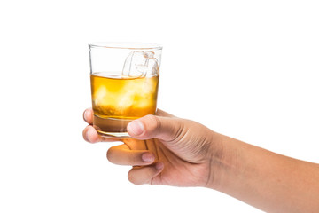 Hand holding a glass of whiskey on the rocks