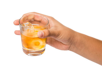 Hand holding a glass of whiskey on the rocks