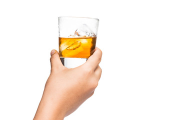 Hand toasting a glass of whiskey on the rocks © ThamKC