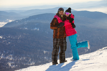 Happy snowboarding couple