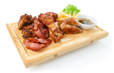 Restaurant food isolated - grilled meat assortment served on woo