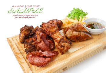 Restaurant food isolated - grilled meat assortment served on woo