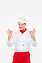 portrait cook man doing a success symbol against