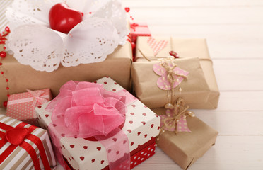 Beautiful gift boxes on wooden background. Valentine Day