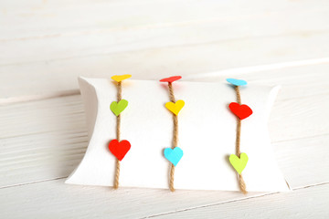 Beautiful gift box on wooden table. Valentine Day concept