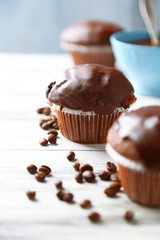 Tasty homemade chocolate muffins and cup of coffee