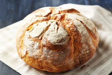 Fresh bread on old wooden table