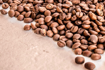 Coffee beans on white paper
