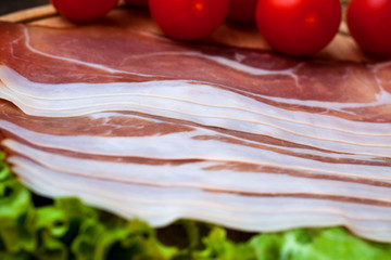 Bacon with cherry tomato and leaf of green salad