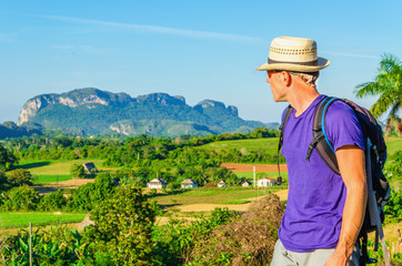 Young hiker admires the beautiful landscape in Vinales, Cuba - 78819685