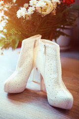 Photo of warm winter white wedding shoes
