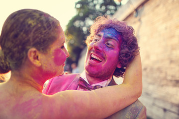 Lovers in Paris playing with holi powder