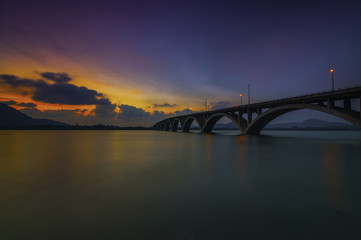 Fototapeta na wymiar A Wonderful and Colorful Nice Sunset Behind The Bridges