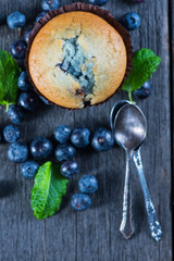 Blueberry muffins on wooden table from above