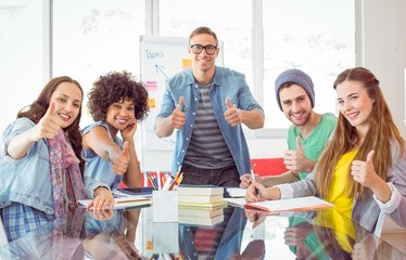 Fashion students smiling at camera together