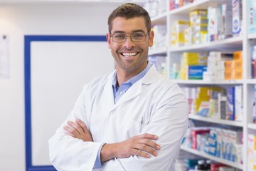 Handsome pharmacist smiling at camera