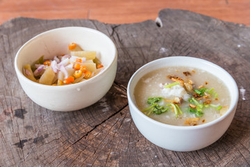 Bowl of oats porridge on wooden table. Healthy breakfast