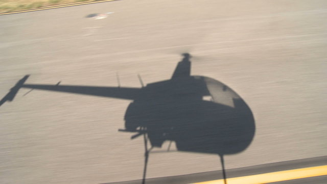 Shadow of Helicopter talking off.