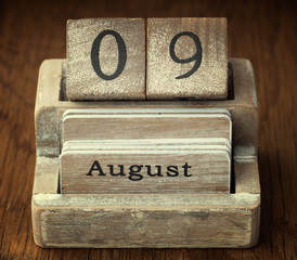 A very old wooden vintage calendar showing the date 9th August o
