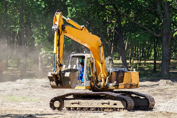 Fototapeta na wymiar Excavator is working at the construction site