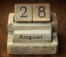 A very old wooden vintage calendar showing the date 28th August
