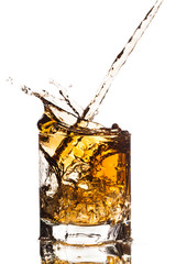 water splash in glass isolated on white