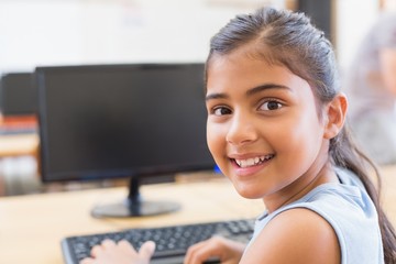 Cute pupil in computer class