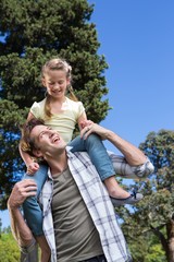 Father and daughter having fun in the park