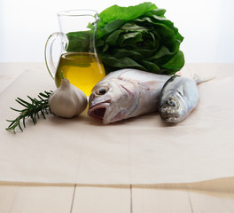 Fresh fish with garlic, rosemary and olive oil