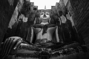 The main Buddha statue in Sukhothai, Thailand, black and white