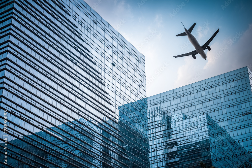 Wall mural futuristic building with airplane