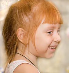 Closeup portrait of beautiful little girl smiling