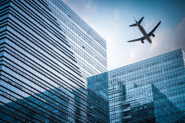 Fototapeta na wymiar futuristic building with airplane