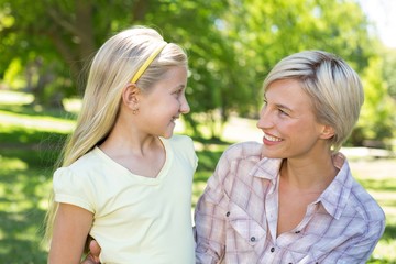 Pretty blonde with her daughter in the park