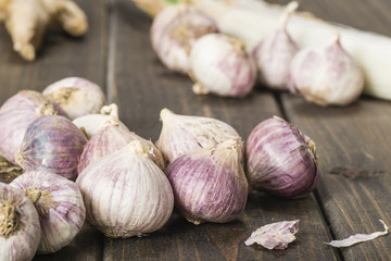purple garlic on the wooden board