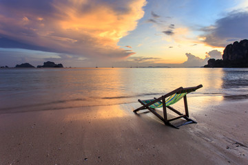 sun loungers stand on the sunset beach