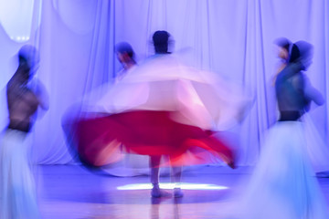 Group of contemporary dancers performing on stage