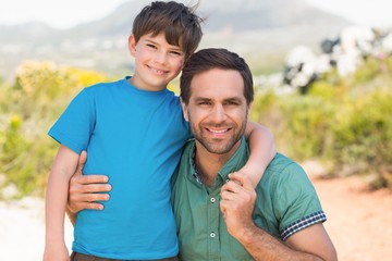 Father and son hiking through mountains