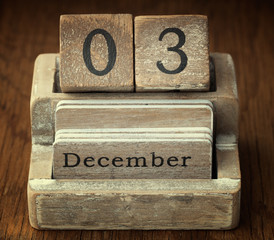 A very old wooden vintage calendar showing the date of 3rd Decem
