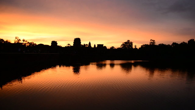 Silhouette of the Main Temple Buildings with Lake Reflection at Sunrise - Angkor Wat, Cambodia