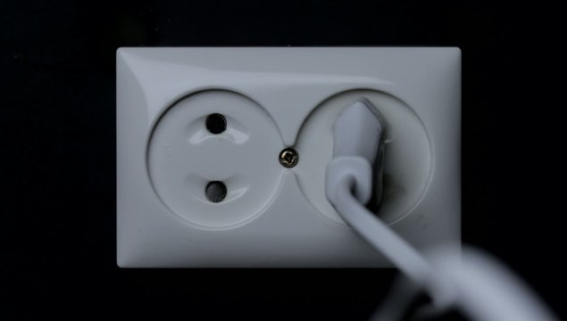 Fire in European style dual power wall socket. Real flames.