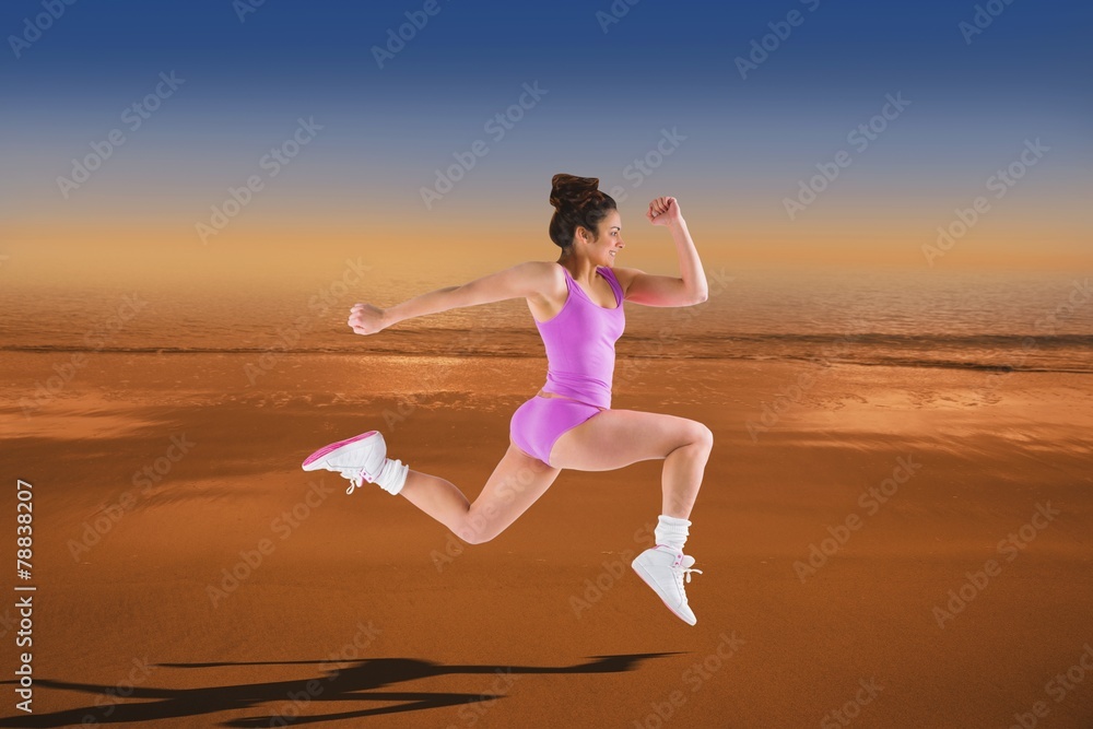 Poster Composite image of fit brunette running and jumping