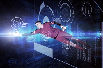 Composite image of fit goal keeper jumping up